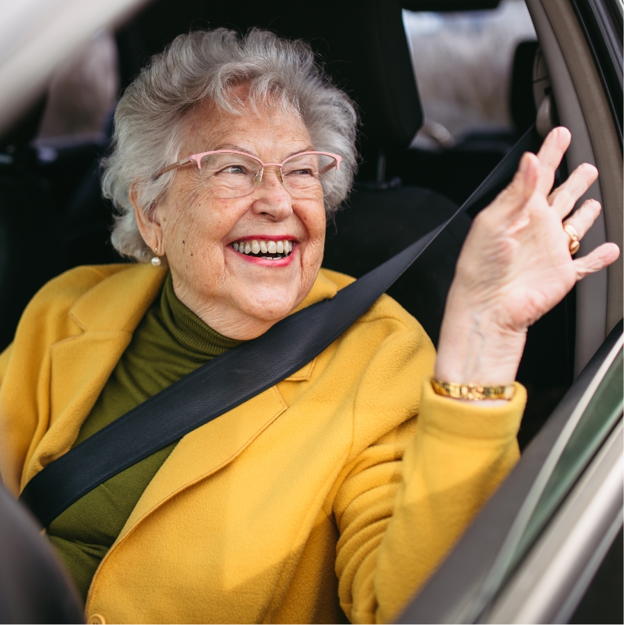 happy-senior-woman-driving-car-alone-r.jpg